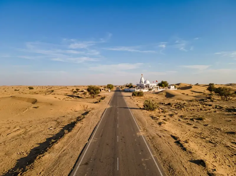 Desert highway leading to Tanot Mata Temple near the border in Jaisalmer district
